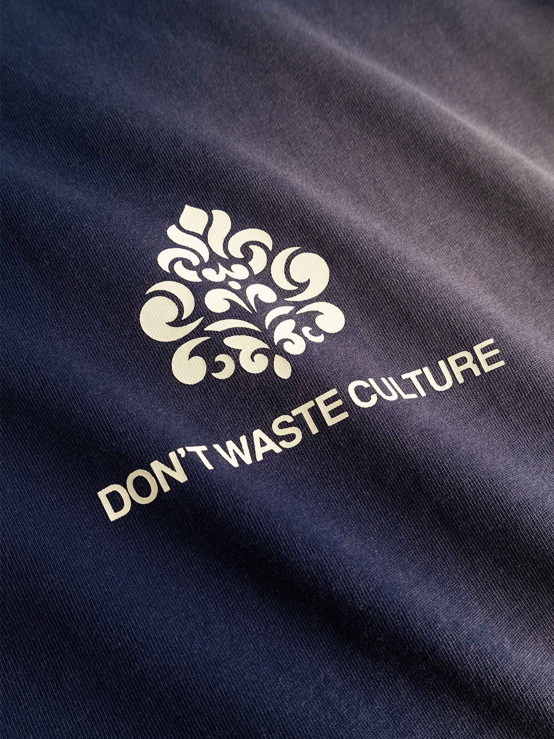 Don't Waste Culture Fade Longsleeve Navy - close-up logo