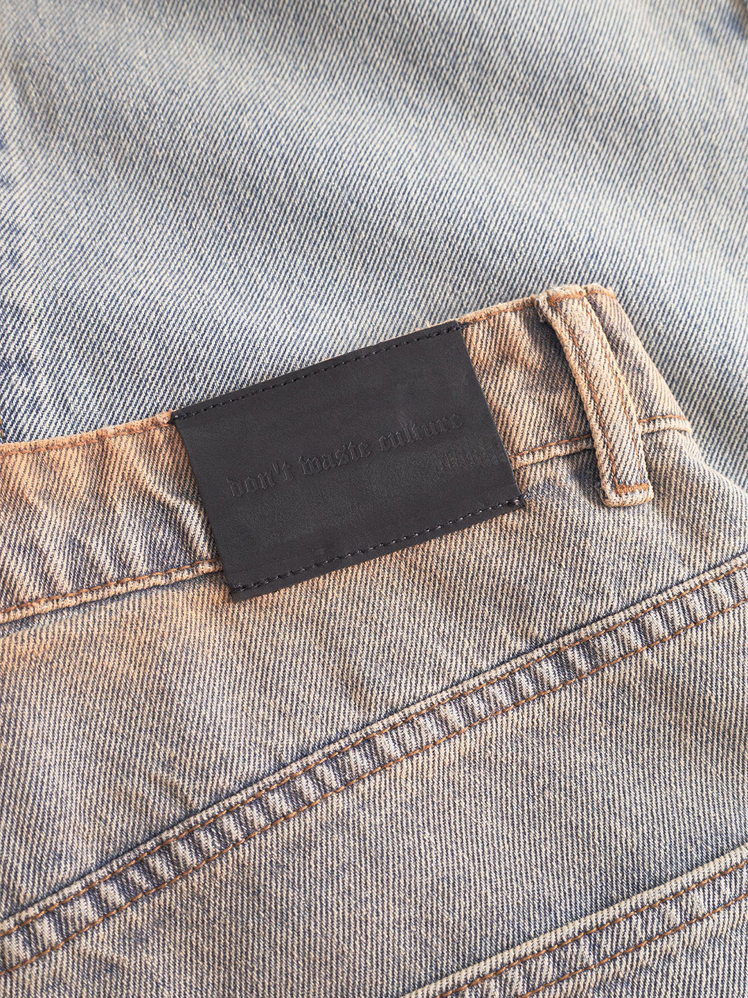 Close-up van de rust fade bij de taille van de Fiorael Jeans