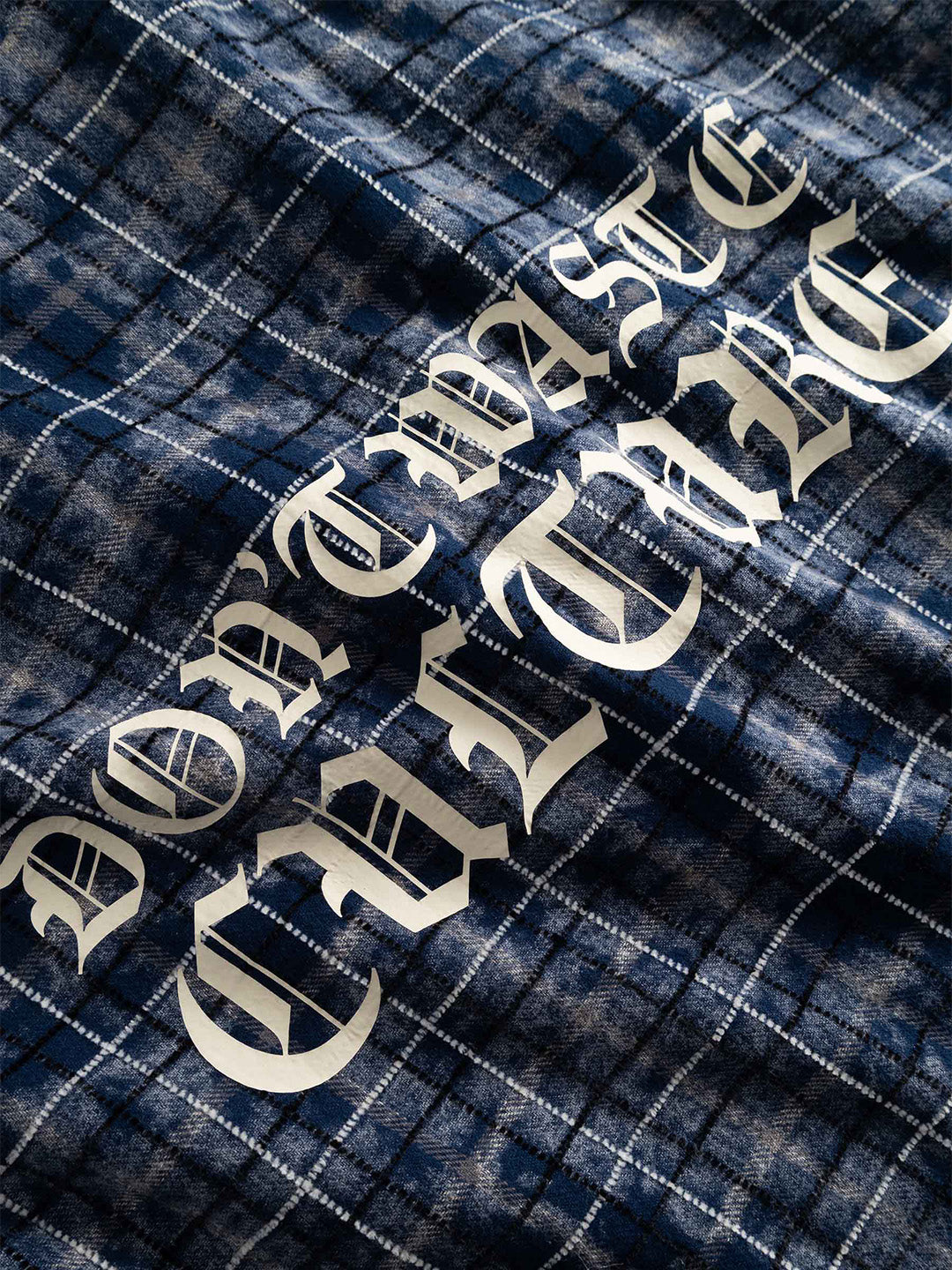 Don't Waste Culture Levi Shirt Navy - close-up graphic