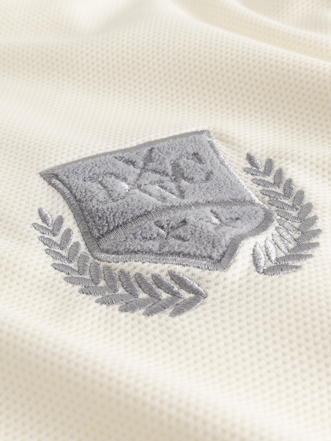 Don't Waste Culture Momohana Football T-Shirt Cream - close-up logo