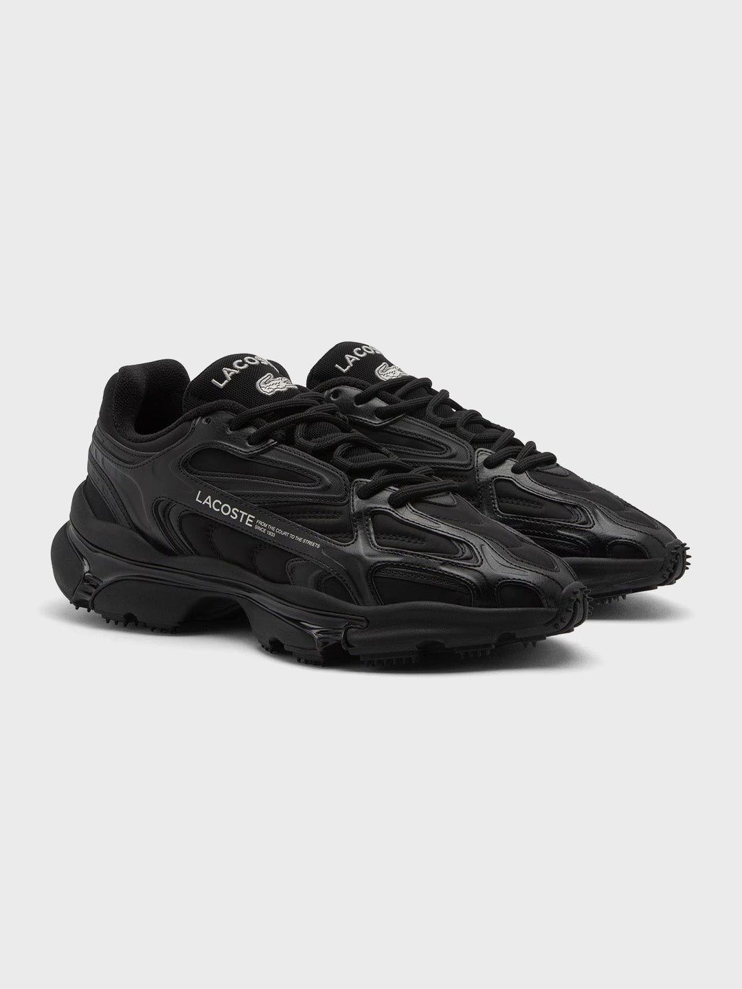 Schuin vooraanzicht van Lacoste L003 2K24 sneakers Black
