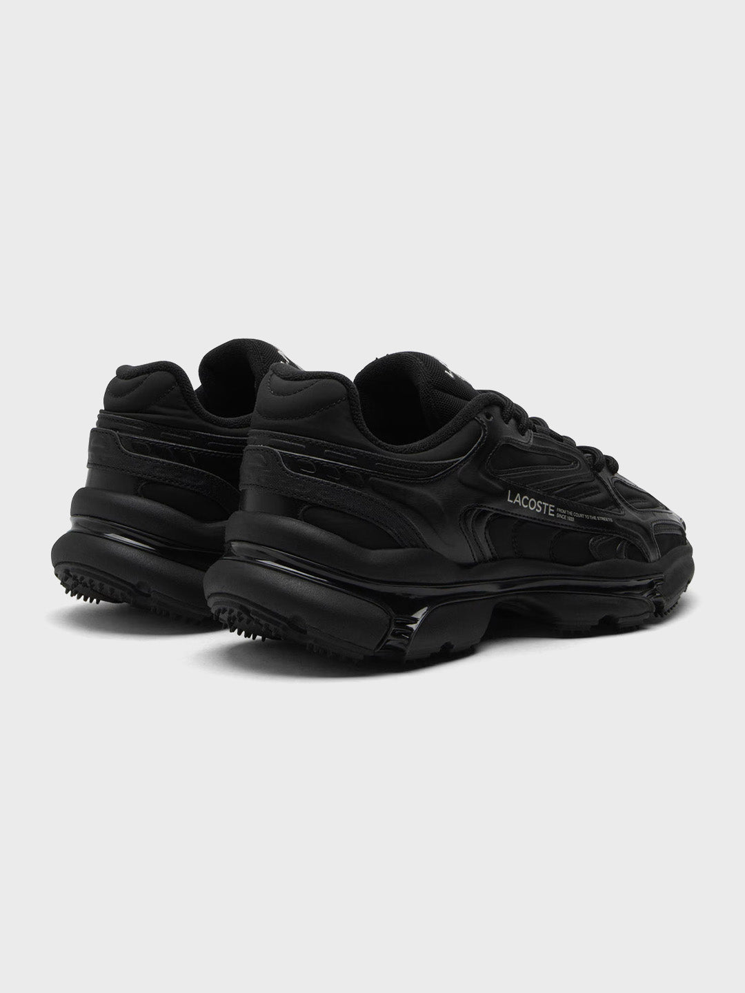 Schuin achteraanzicht van Lacoste L003 2K24 sneakers Black
