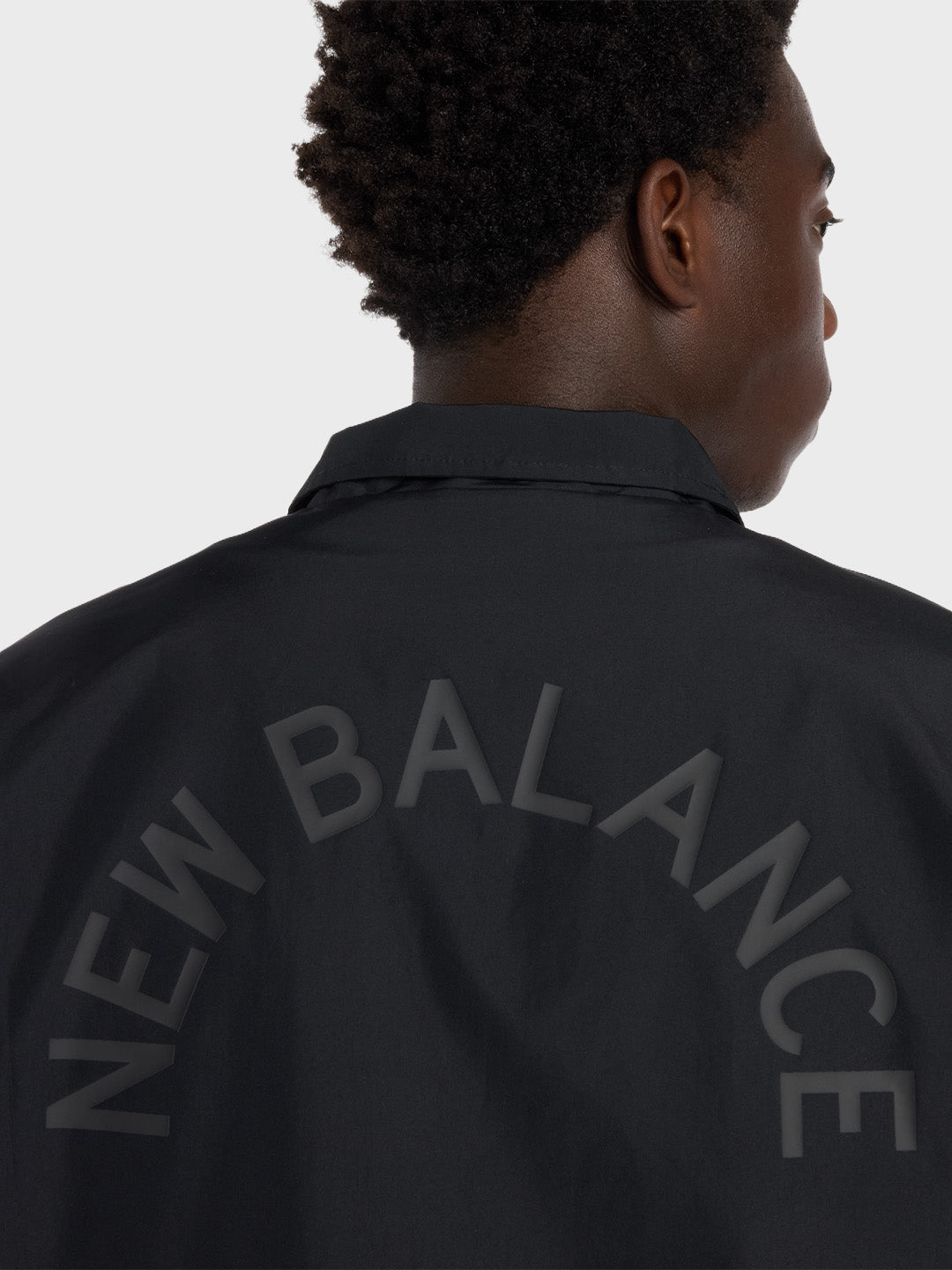 New Balance Coach Jacket Black close-up ruggraphic