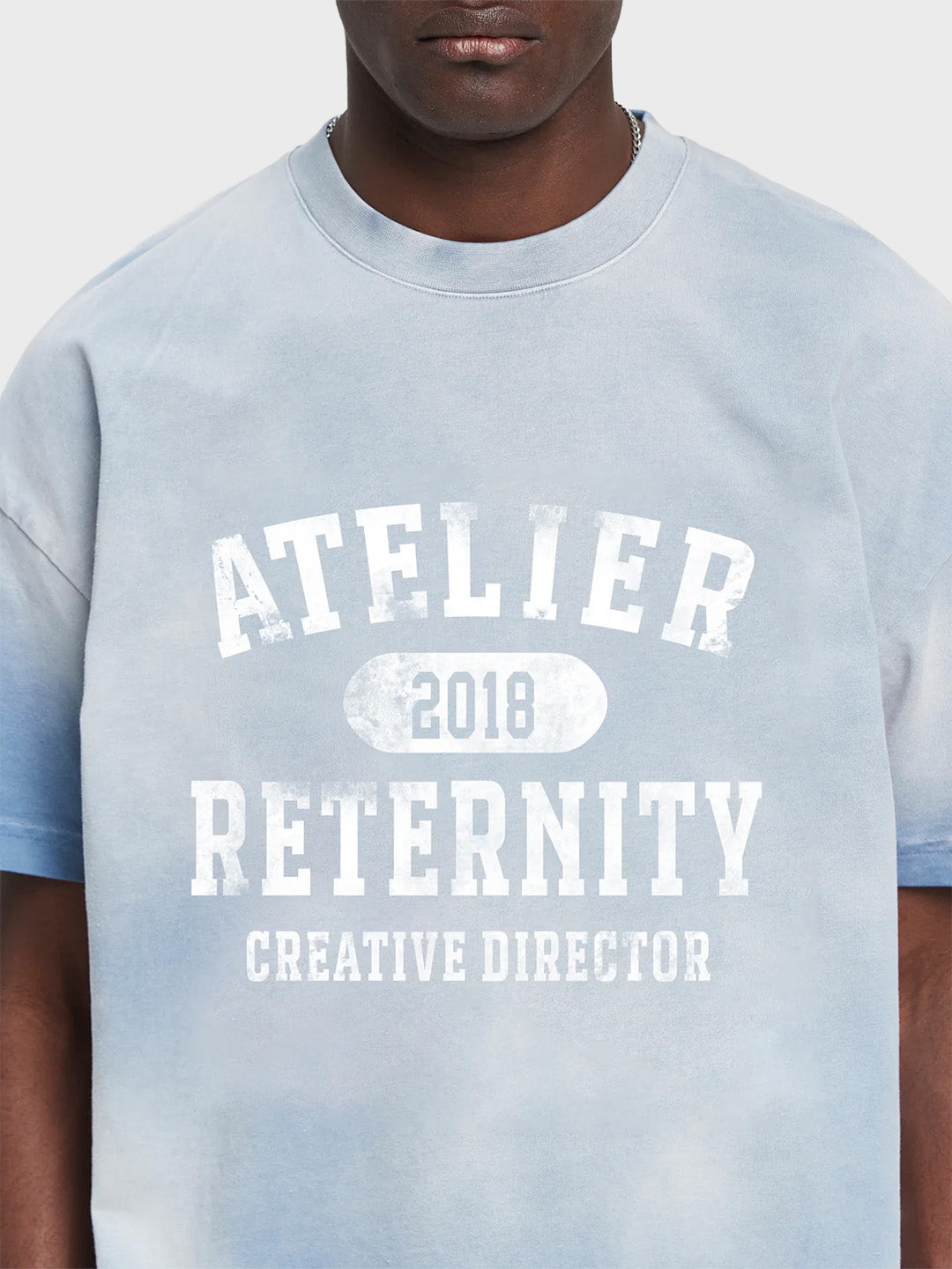 Reternity Atelier Emblem T-Shirt Bleached Blue - close-up graphic