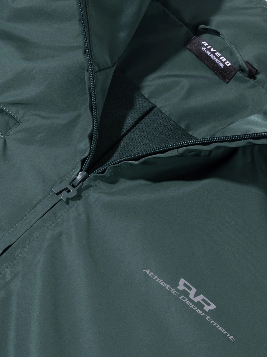 Rivero Unity Track Jacket Green - close-up Rivero graphic