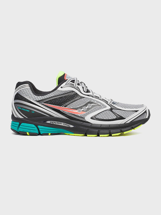Zijaanzicht van de Saucony Guide 7 sneaker in wit, grijs en teal met kleurrijke details