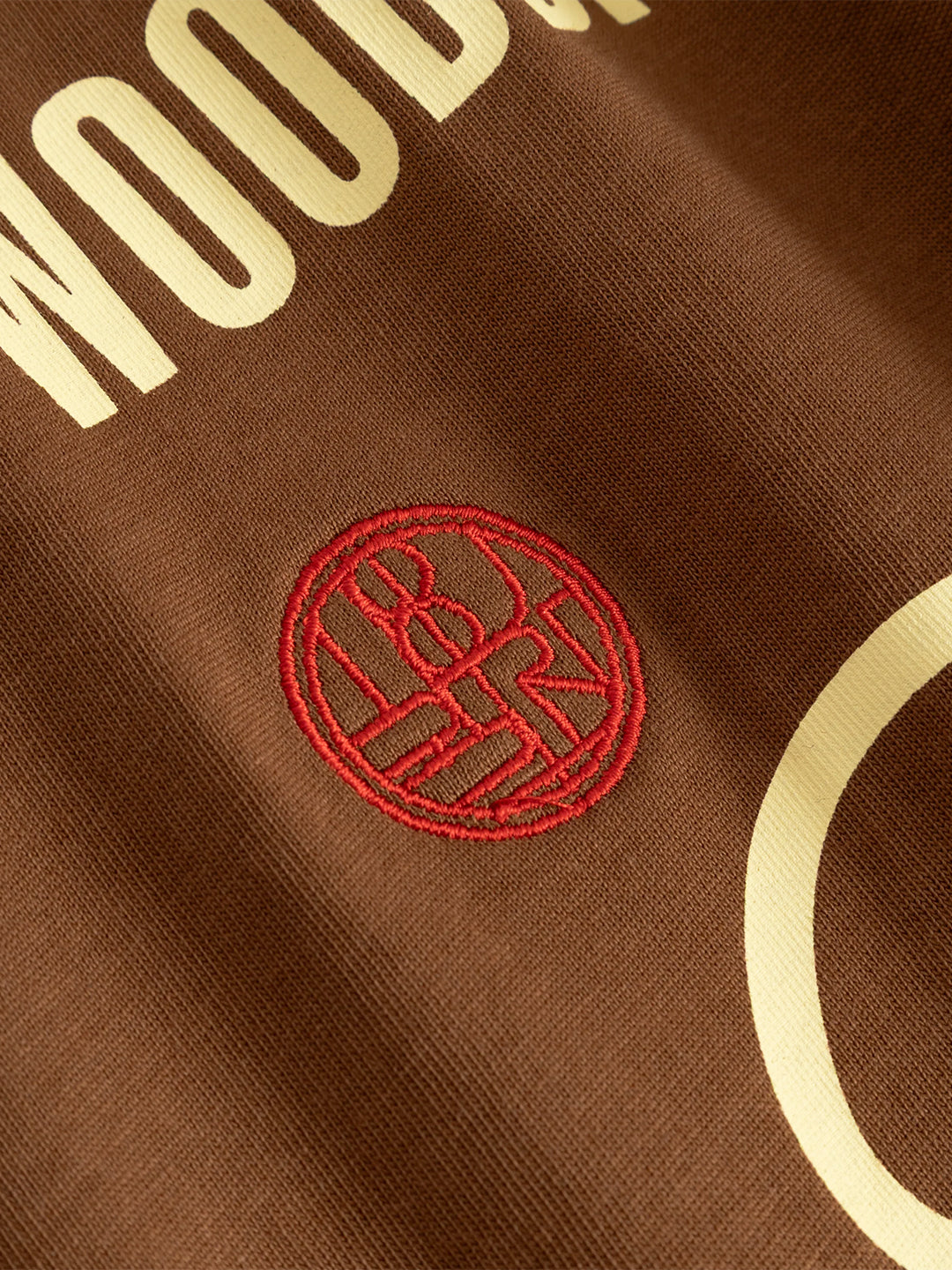 Woodbird WBBeam Lion T-Shirt Brown - close-up logo