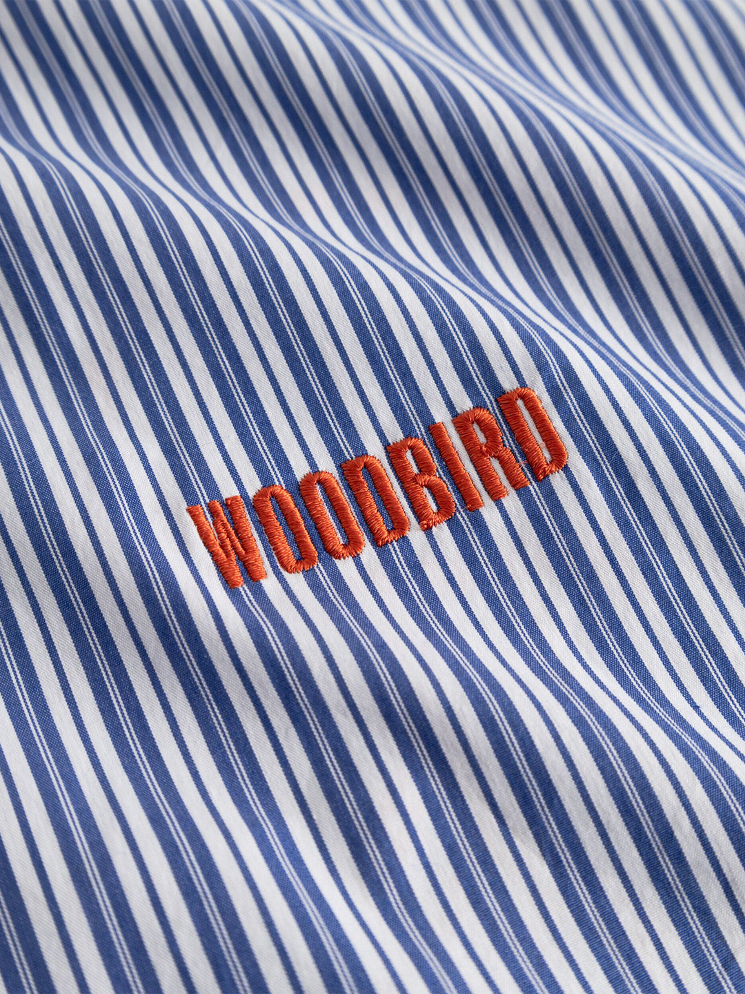 Woodbird WBBrooks Lion Shirt Light Blue - close-up logo